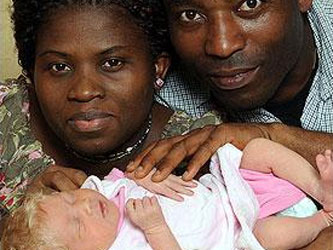 White baby, black parents, could be a miracle. Black British parents had a baby that was born white with blonde hair and blue eyes.